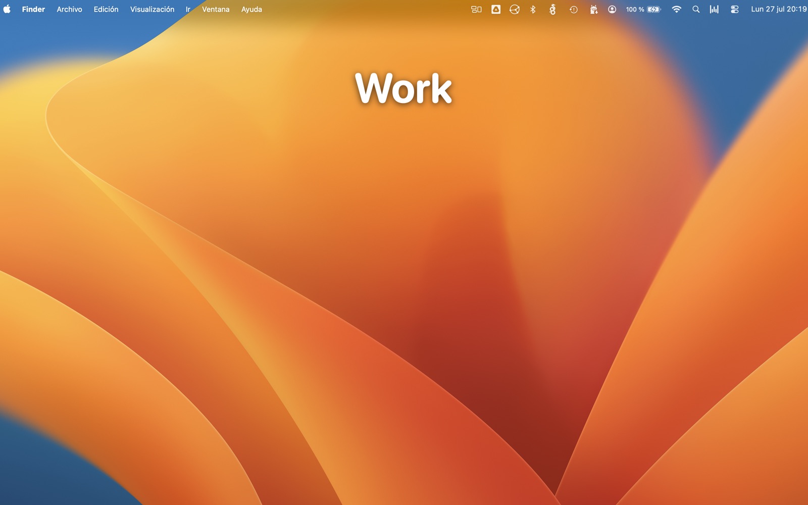 A Mac desktop with a large, readable label reading Work floating at the top of the screen